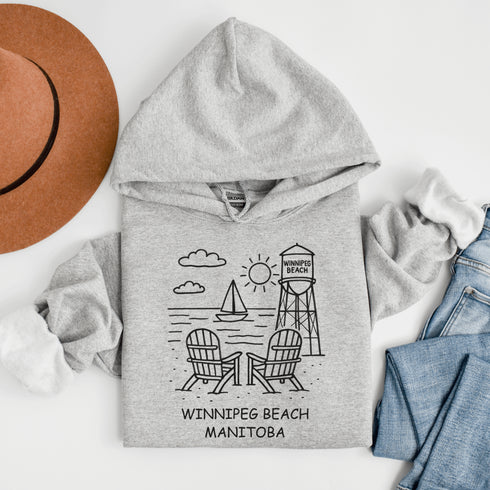 Cozy up in coastal charm with our Winnipeg Beach Doodle Hoodie, inspired by the laid-back vibe of one of Manitoba’s most beloved lakeside getaways.